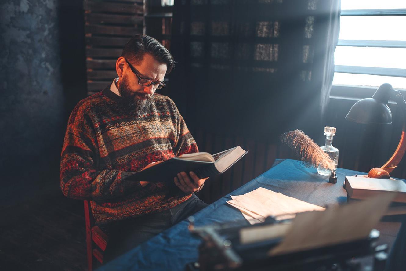 Financial planning documents with notes and pen on wooden table